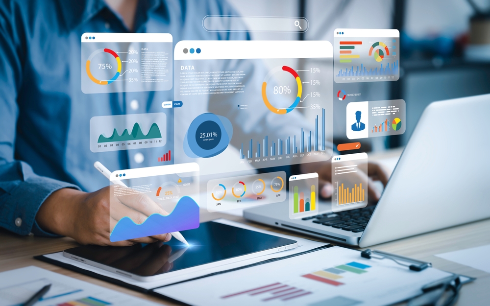 An,Analyst,Uses,A,Computer,And,Dashboard,For,Data,Business Business team analyzing financial data and marketing growth